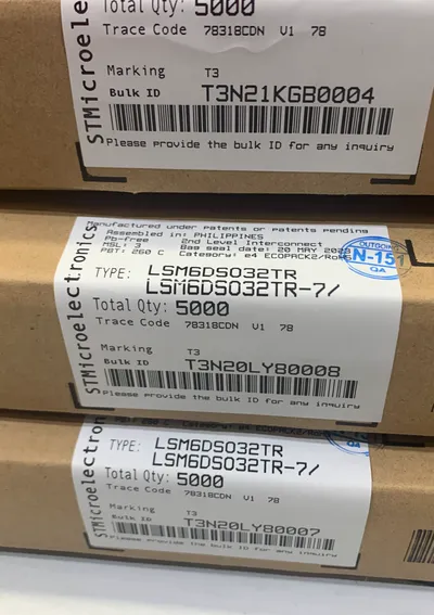 Sealed STMicroelectronics factory cartons with intact bulk-ID and date-code labels